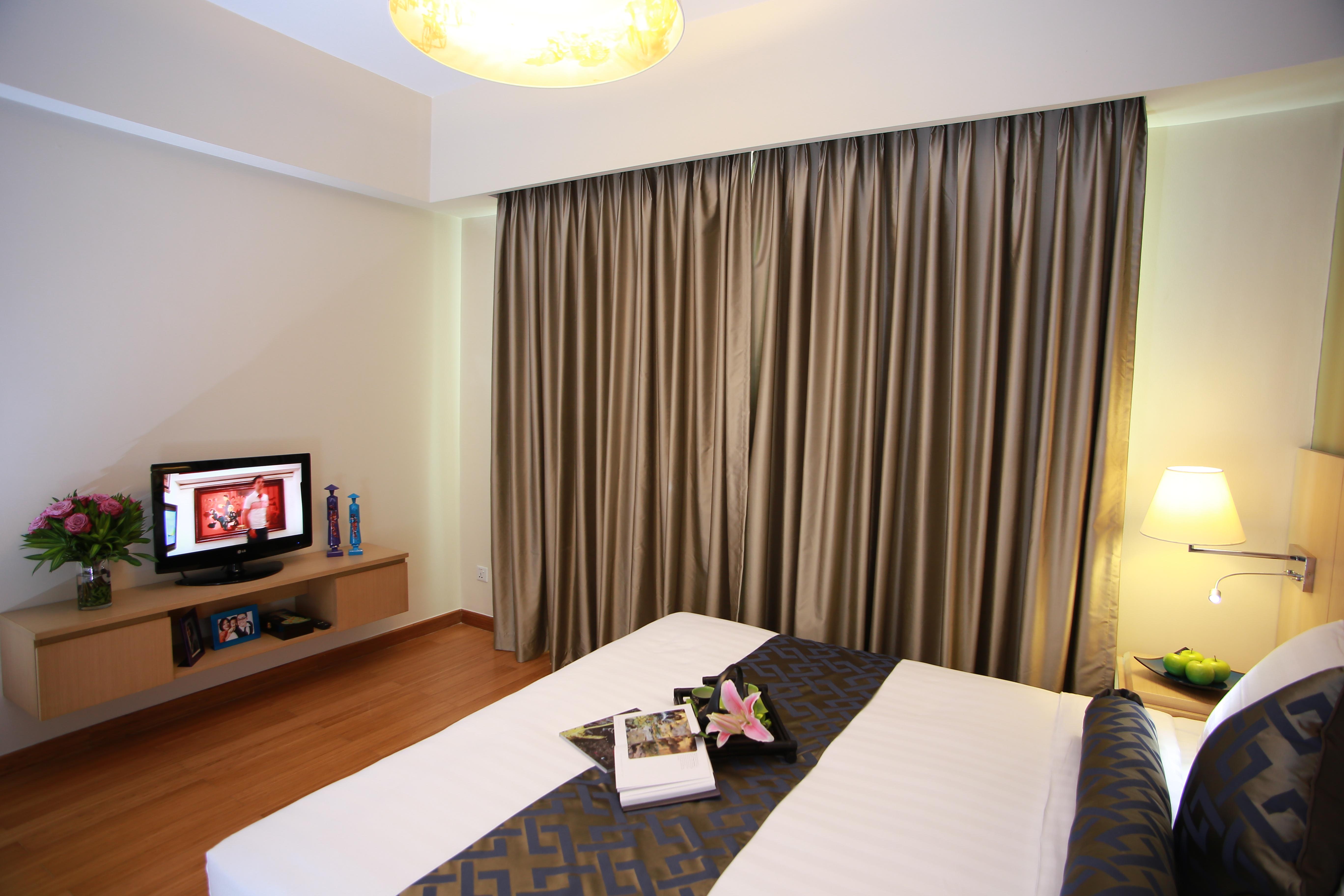 Somerset Ho Si Minh-város Kültér fotó A bedroom at the hotel